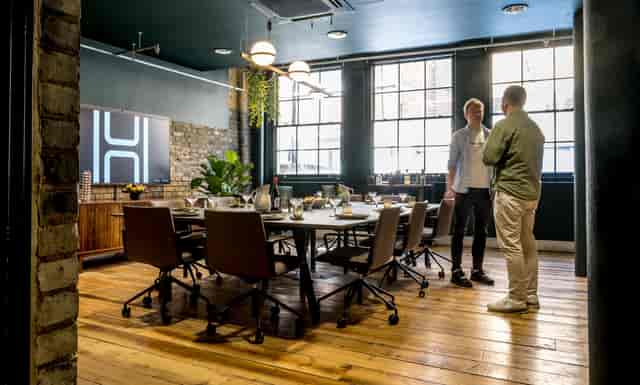 Modern meeting space with large table, ideal for events in Shoreditch, London.