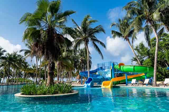 Vibrant pool area with colorful slides at Kimpton Tres Rios for corporate retreats and events.