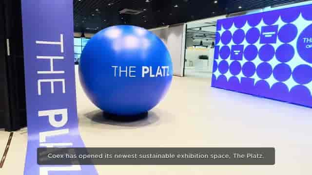 Modern exhibition space at COEX's The Platz with vibrant blue sphere, ideal for events.