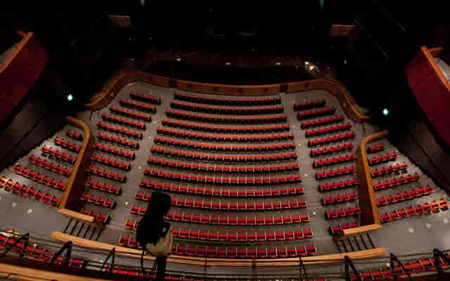 Woori Art Hall auditorium with tiered seating, ideal for conferences and presentations.