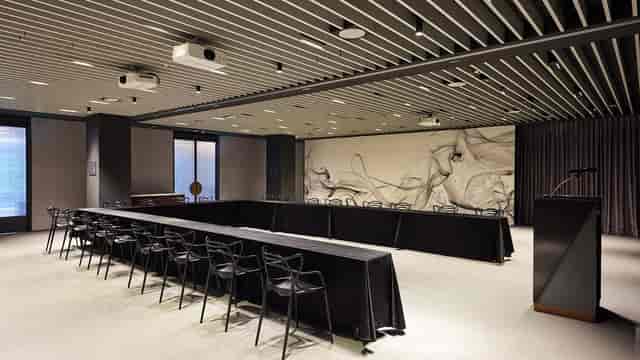 Modern seminar hall in L7 Myeongdong with sleek table setup for corporate meetings.