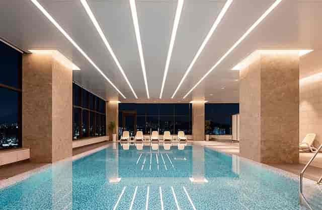 Modern indoor pool at Seoul Dragon City, perfect for upscale events and wellness retreats.