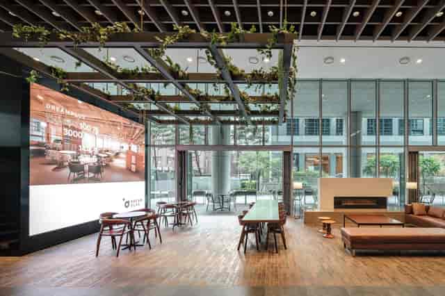 Modern event space with natural light, ideal for networking and workshops.