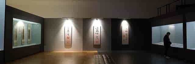 Modern exhibition hall with illuminated wall art, ideal for networking events and gatherings.
