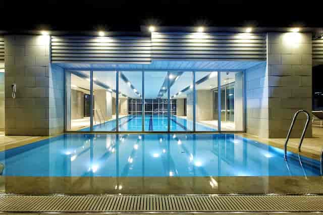 Modern indoor pool at Orakai Songdo Park Hotel, ideal for upscale events and retreats.