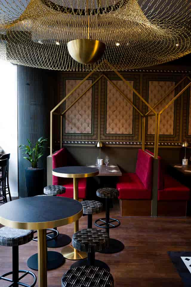 Semi-private hire at Top Hat Restaurant with plush red booths for intimate events.
