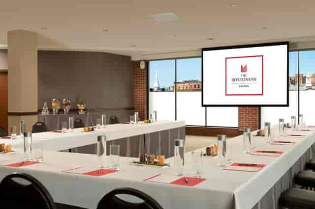 Josiah Quincy Suite meeting room with U-shaped table, ideal for corporate events.