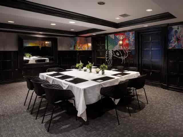 Sophisticated meeting room at The Eliot Hotel, perfect for exclusive events and gatherings.