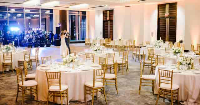 Abigail Adams Ballroom, elegant wedding venue with floral centerpieces and soft lighting.