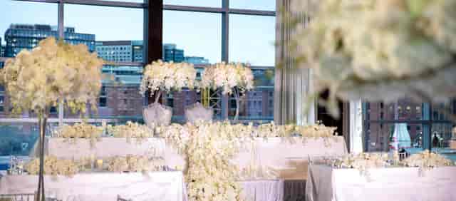 Elegant Abigail Adams Ballroom with white floral arrangement, perfect for weddings and upscale events.