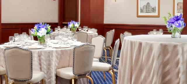 Elegant event space at The Colonnade Hotel with floral centerpieces for meetings and celebrations.