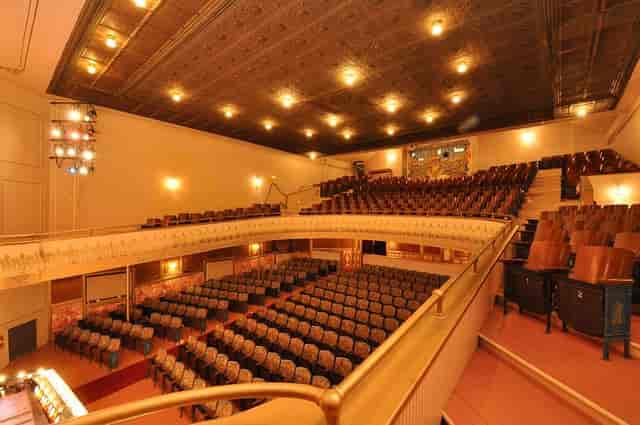 Larcom Theatre auditorium with tiered seating, perfect for conferences and performances.