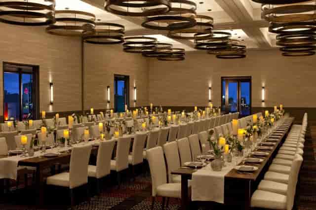 Elegant Fenway Ballroom banquet hall with white linens, ideal for weddings and corporate events.