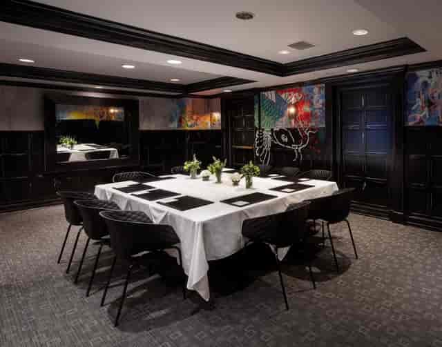 Elegant Charles Boardroom at Hotel Commonwealth, perfect for intimate meetings and events.