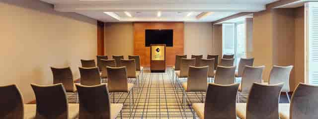 Charles Boardroom at Hotel Commonwealth, ideal for presentations and training sessions.