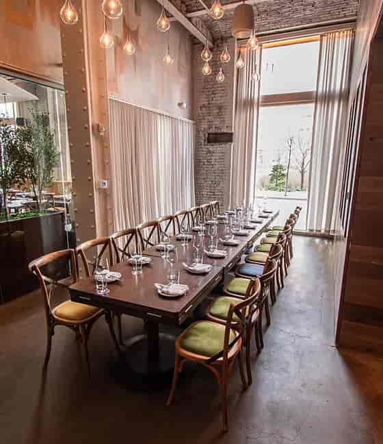 Private dining room with elegant table, ideal for intimate gatherings and corporate events.