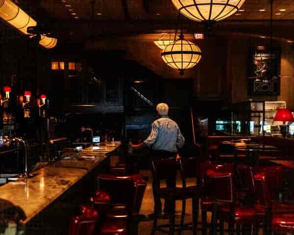 Dimly lit restaurant with elegant decor, perfect for intimate gatherings and networking events.