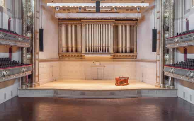 Higginson Hall auditorium with grand organ, perfect for concerts and events.