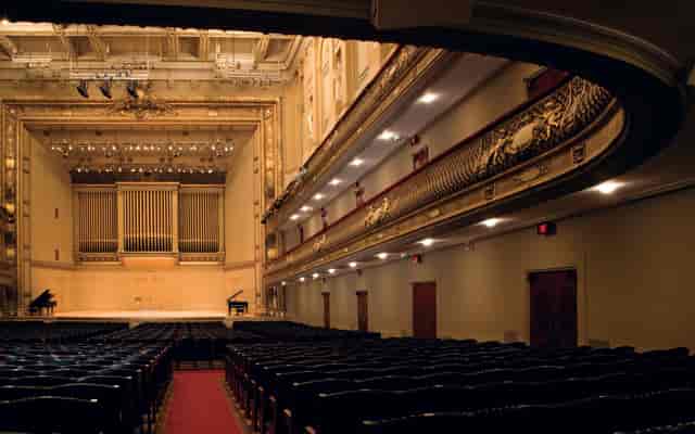Higginson Hall auditorium with ornate architecture, perfect for elegant events and performances.
