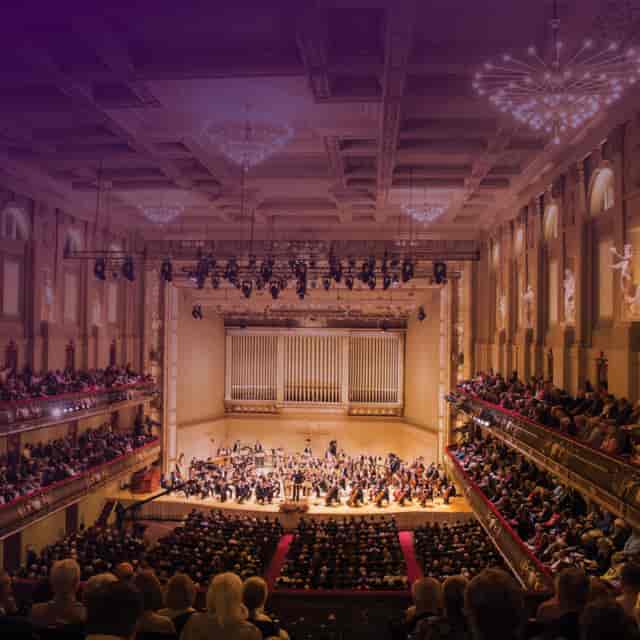 Elegant concert hall with orchestra, ideal for high-profile events and performances.