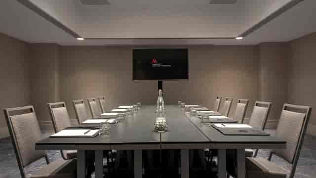 Modern conference room in Boston Marriott Cambridge with sleek table for professional meetings.
