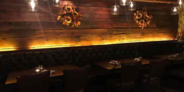 Cozy gastropub dining space with rustic decor, ideal for intimate gatherings and events.