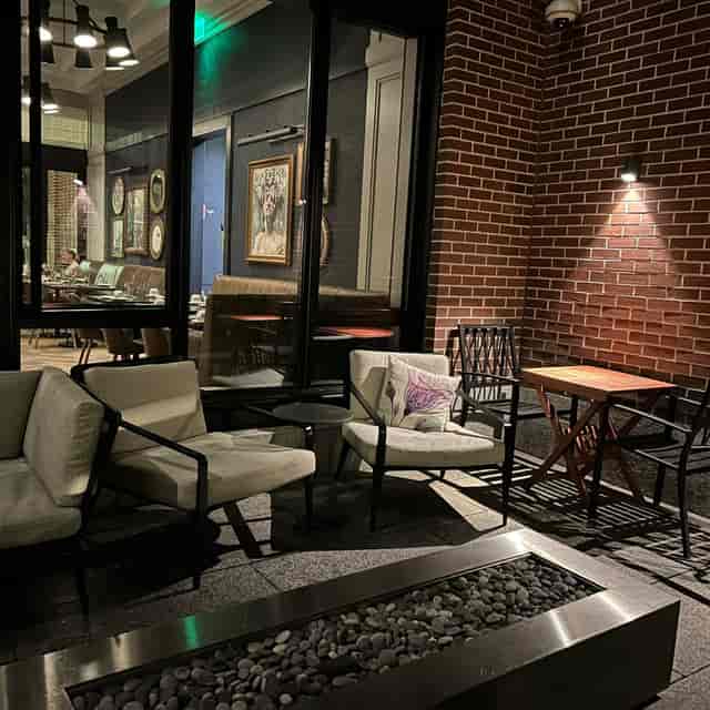 Cozy outdoor seating at Peregrine, Whitney Hotel Boston for networking events.