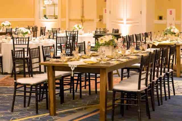Elegant event space at Celebrate Ballroom, Boston Marriott, with floral centerpieces and chiavari chairs.