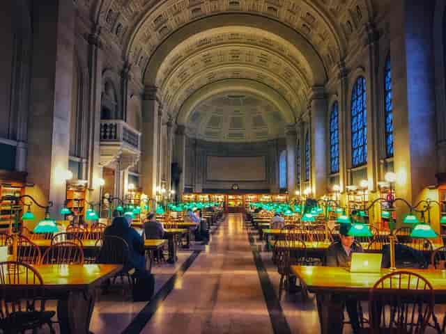 Boston Public Library's Popular Reading Room with green lamps, ideal for workshops and meetings.
