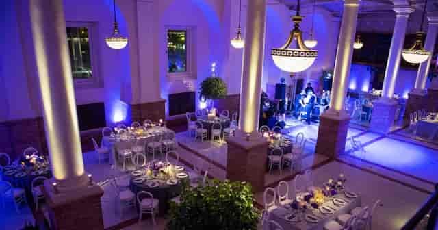 McKim Building Guastavino Room: elegant event space with floral centerpieces, ideal for weddings.