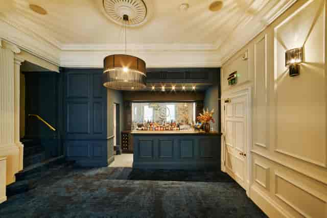 Sophisticated event space with elegant bar, ideal for networking and cocktail receptions.