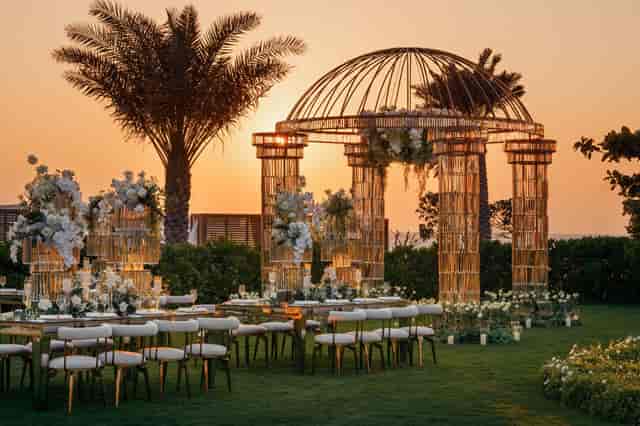 Elegant floral arch at Nuska Garde, Jumeirah Beach Hotel for upscale weddings.