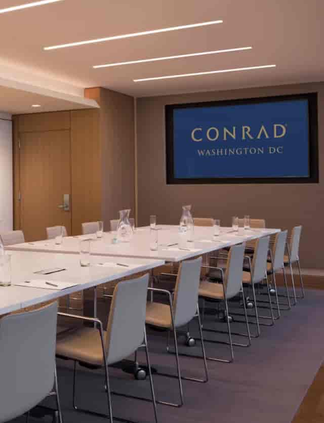 Modern meeting room at Conrad Washington DC, ideal for professional events and gatherings.