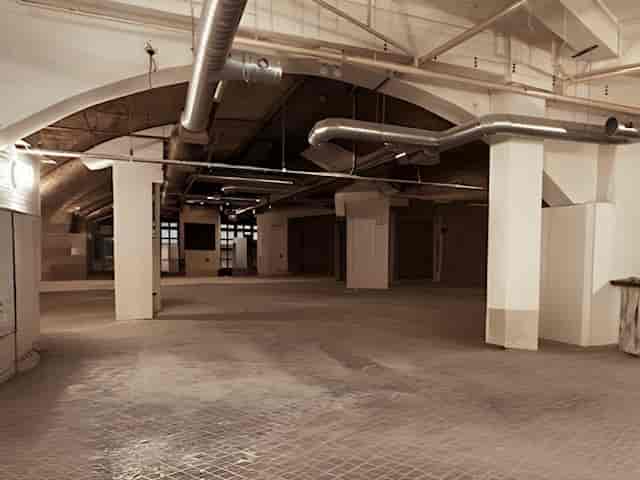 Spacious industrial venue with high ceilings for corporate events at One America Square.