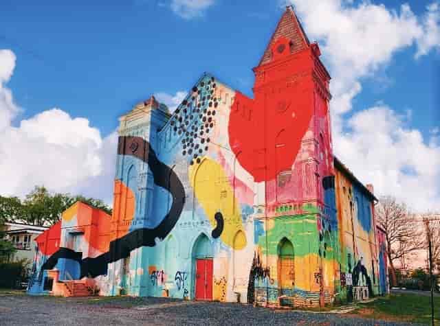 Vibrant mural-covered Culture House lounge for creative events and art exhibitions.