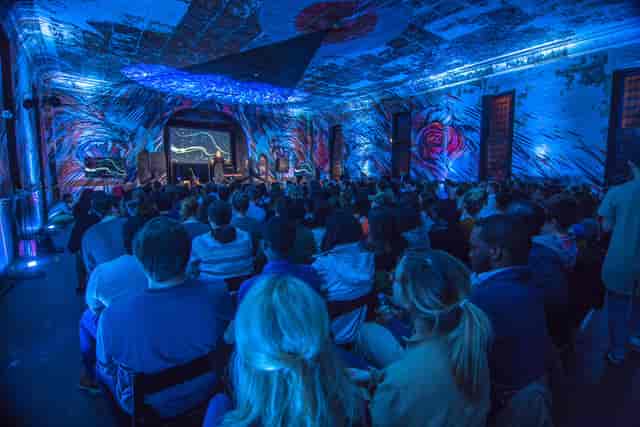 Vibrant Culture House lounge with dynamic lighting for engaging panel discussions.