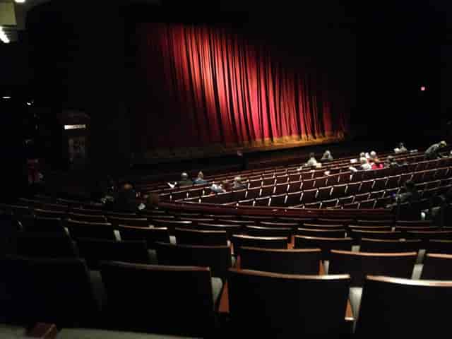 Harman Hall theater with red curtain, ideal for engaging live performances and events.