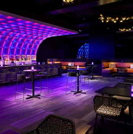 Modern event space at VUE Rooftop DC with vibrant purple lighting for cocktail receptions.