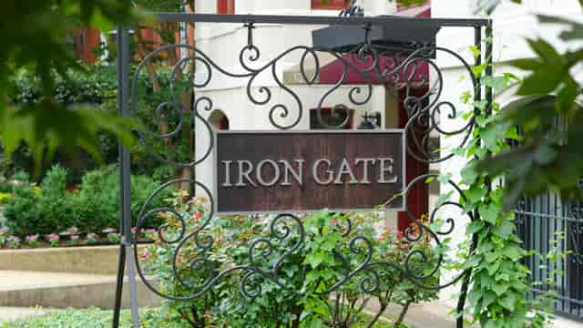Elegant Iron Gate restaurant entrance sign, perfect for upscale weddings and events.