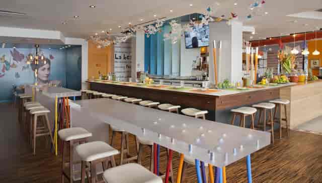 Modern event space at Butterfly Bar & Tables, ideal for cocktail receptions and meetings.