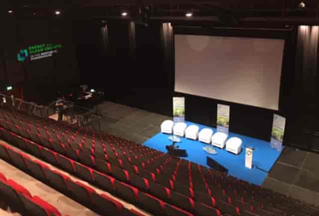Main Auditorium at Connexin Live, Hull - stage set for panel discussion, professional event space.