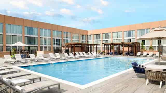 L'Enfant Bar and Grill pool area, ideal for summer receptions and outdoor networking events.