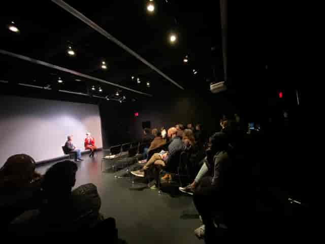 Intimate panel discussion in dimly lit Lab II, Atlas Performing Arts Center.