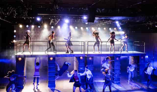 Dynamic stage with dancers at GALA Theatre for engaging entertainment events.