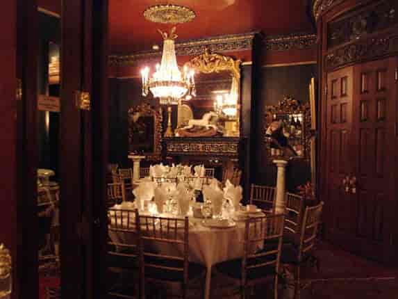 Elegant ballroom dining room with chandelier, perfect for upscale events and gatherings.