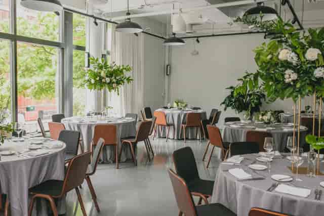 Elegant event space in Eaton DC with gray linens and floral centerpieces for gatherings.