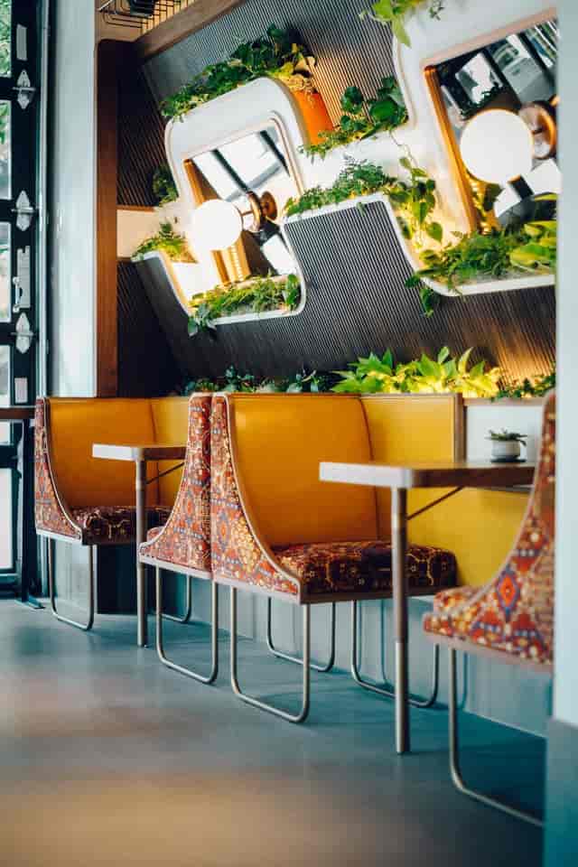 Kintsugi Cafe seating area with cozy booths, ideal for networking events in Eaton DC.