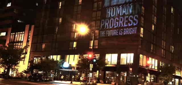 "Sidney hotel in Eaton DC with 'HUMAN PROGRESS' projection for innovative conferences."