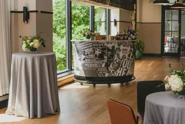 Stylish Eaton DC event space with sleek bar and elegant tables for networking gatherings.
