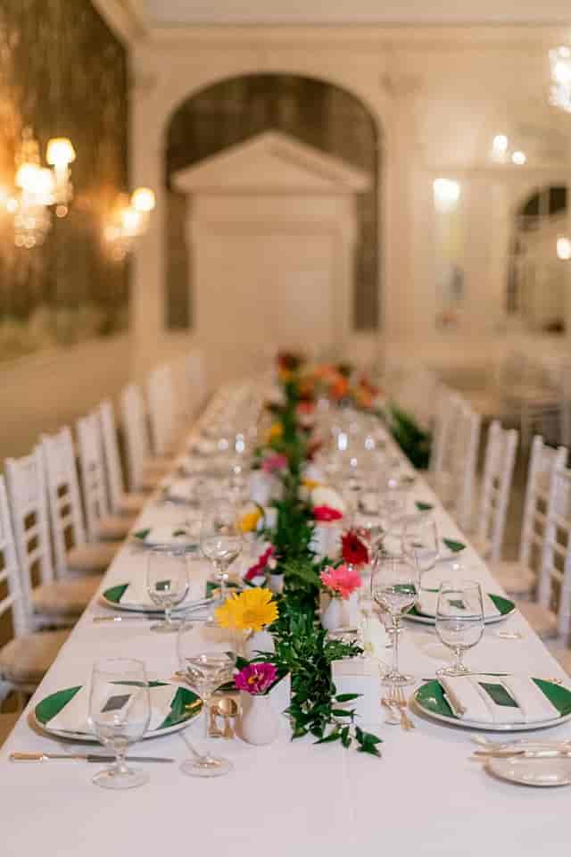 Elegant banquet table with floral centerpiece at Clubhouse, City Tavern for formal events.